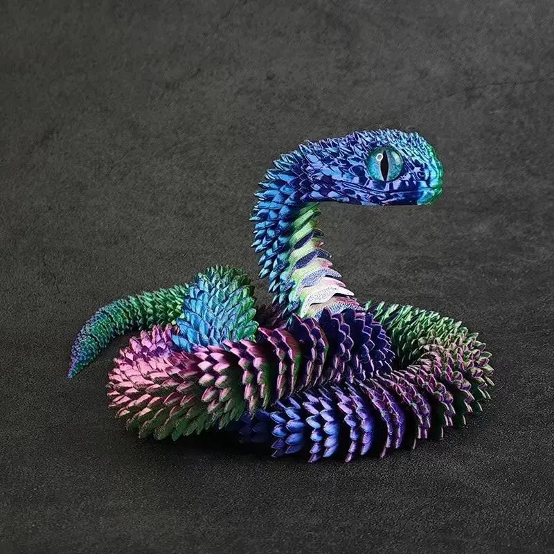 A vibrant blue and purple 3D printed snake art model coiled on a dark surface.