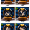 Eight zodiac signs represented by crystal balls showing corresponding constellations and imagery.