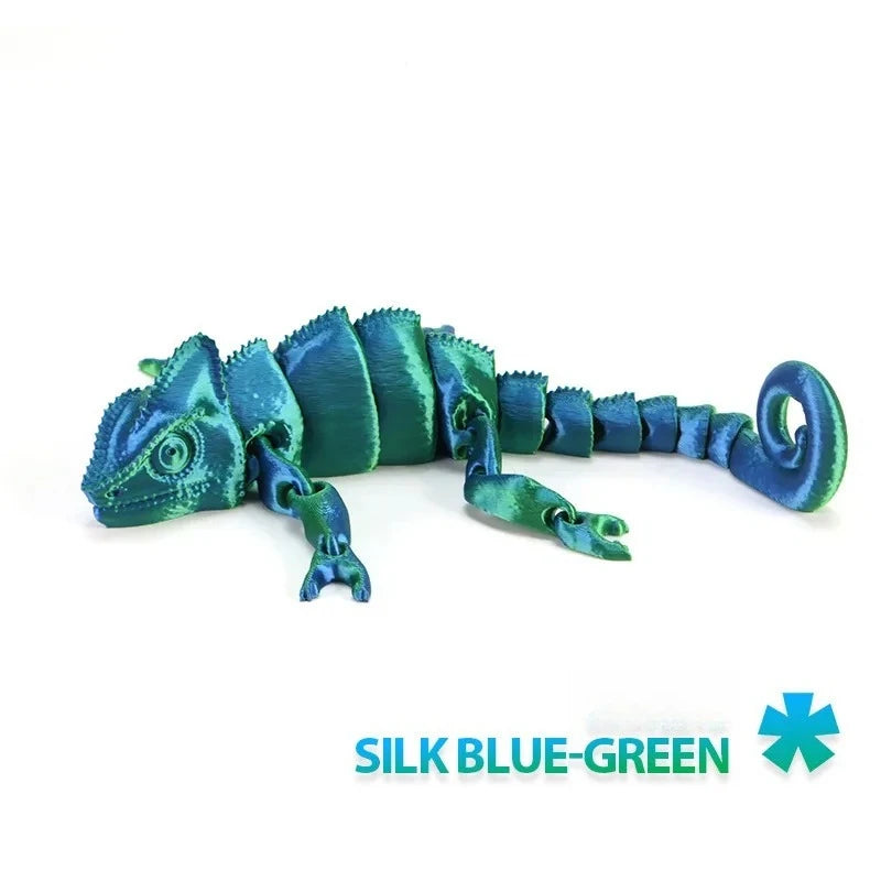 A blue-green articulated dragon lizard figurine with textured scales.