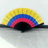 A handheld folding fan with a rainbow design featuring yellow, blue, and pink stripes.