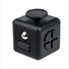 A black fidget cube with a round top and a textured side panel.
