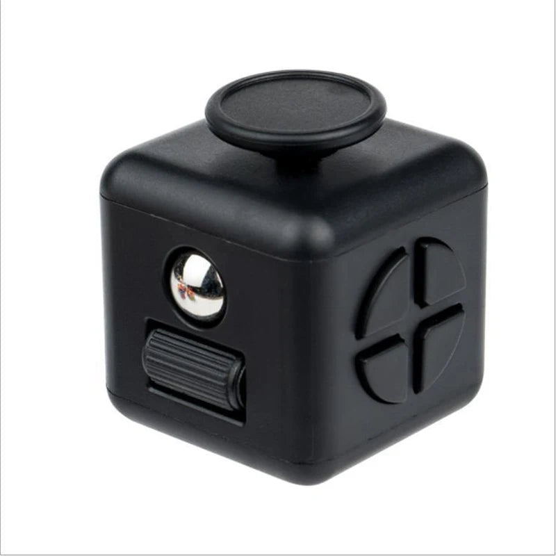 A black fidget cube with a round top and a textured side panel.