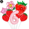 A set of pink and red strawberry balloons, including a flower balloon and a large number six balloon.