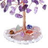 A crystal money tree decor featuring purple and blue amethyst-like crystals on a wooden branch.