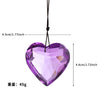 Purple crystal heart prism pendant hanging by a black cord