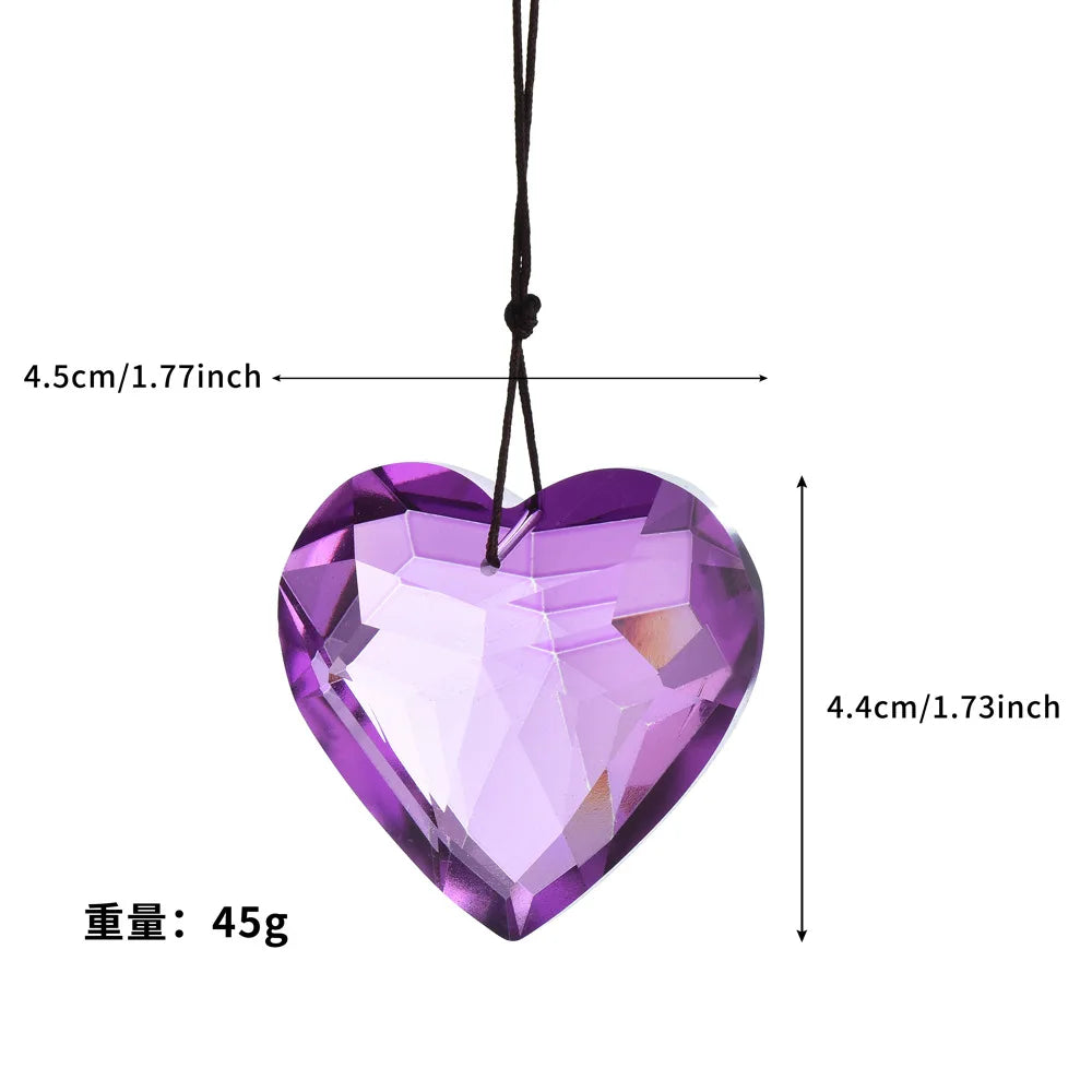 Purple crystal heart prism pendant hanging by a black cord