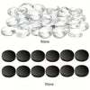 A collection of clear, round decorative refrigerator magnets and black circular magnets for custom crafts.