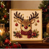 A framed piece of pearl and diamond painting depicting a deer head with antlers and festive greenery.