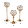 Three crystal candle holders with golden finishes labeled L, M, and S.