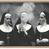 Black and white print of three nuns smoking against a dark background.