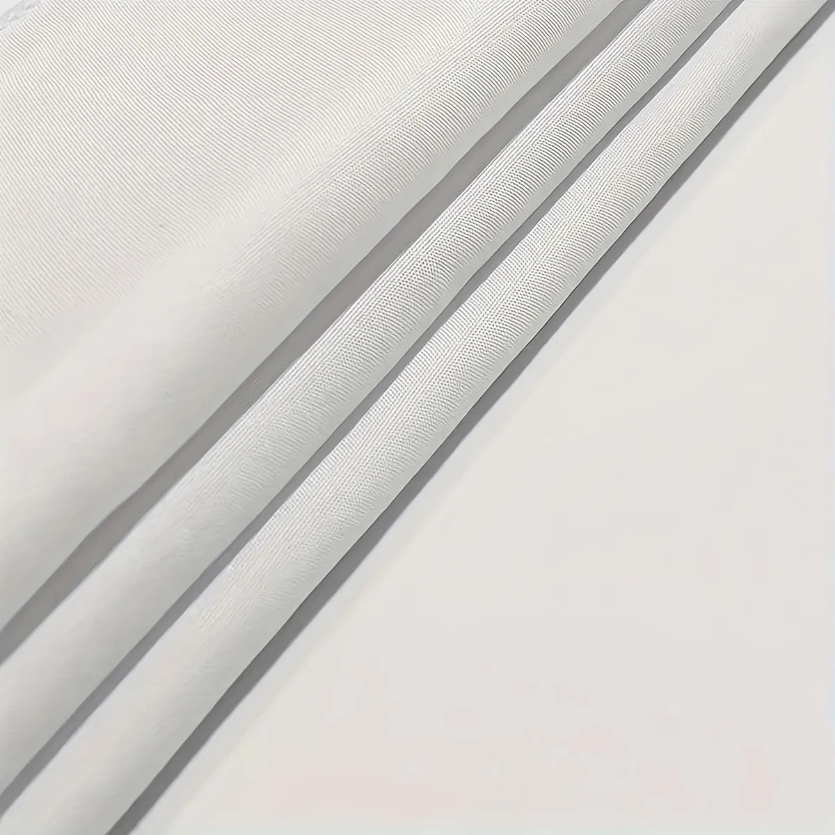 Close-up of a light gray decorative fabric wall tapestry showing folds and texture.