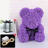 Peluche ours rose violet avec décoration LED et accessoire lumineux séparé.