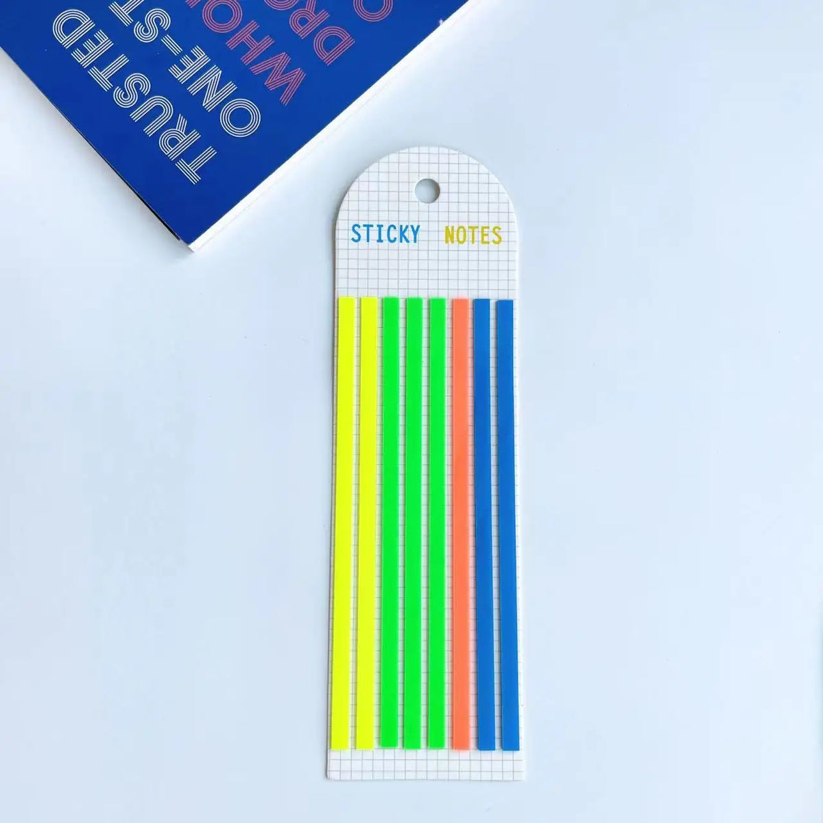 A vertical tag with a hole, labeled STICKY NOTES, featuring 10 colored strips on a white background.