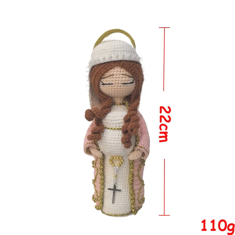 Handcrafted Virgin Mary crochet doll with brown hair and pink clothing, shown against a white background.