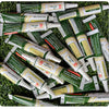 A collection of green and white tubes of Room-Temperature Curing Adhesive for squishy toy repairs