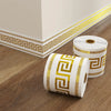 Roll of self-adhesive PVC skirting board trim featuring a gold Greek key pattern and waterproof finish