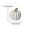 Elegant white and gold resin decorative pumpkin with a textured surface.