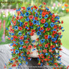 A bouquet of colorful artificial flowers in red, blue, and orange arranged for outdoor decoration.