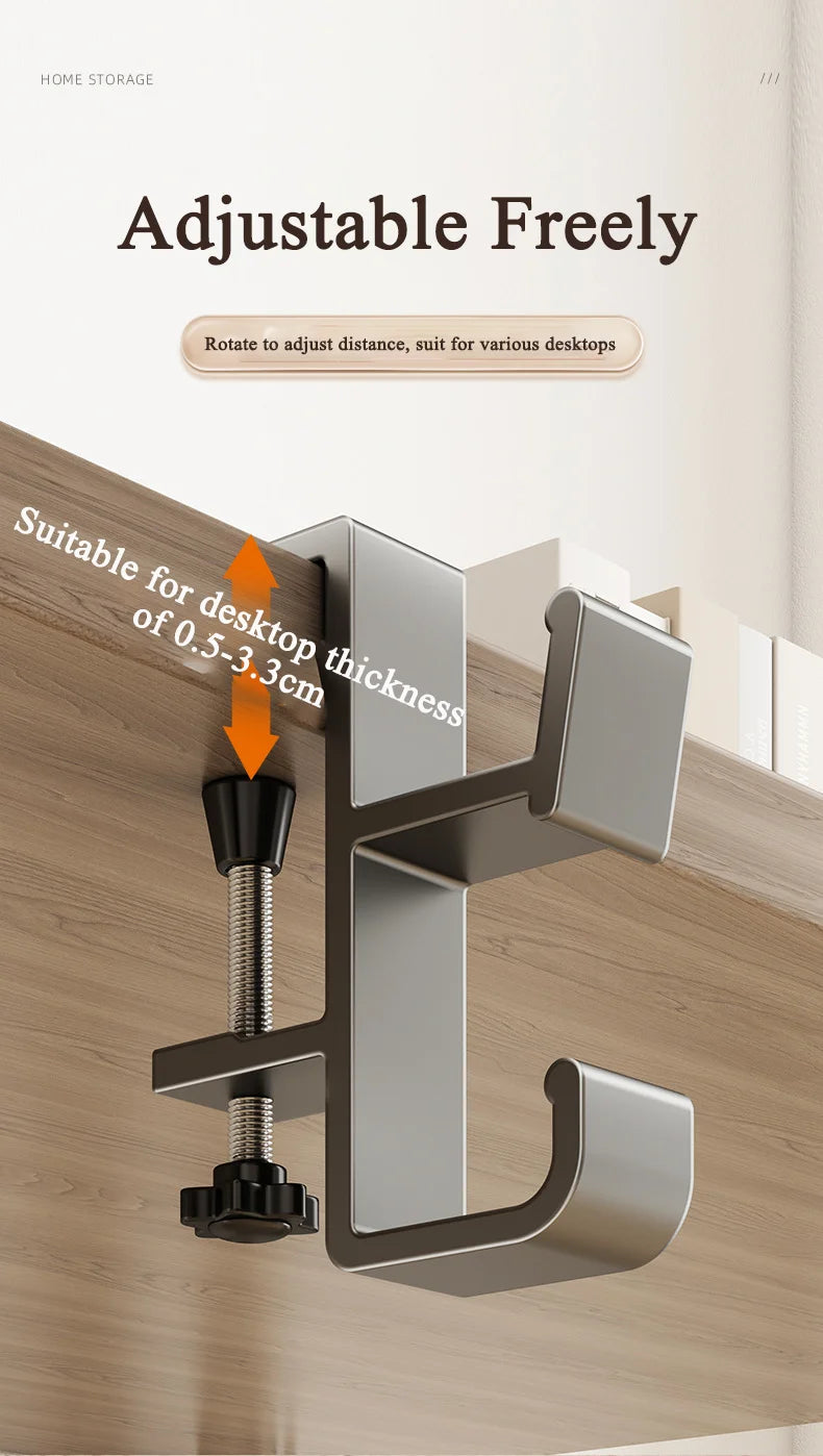 A close-up view of an adjustable desk bag hook mounted on a wooden surface, demonstrating its use for various desktop thickne
