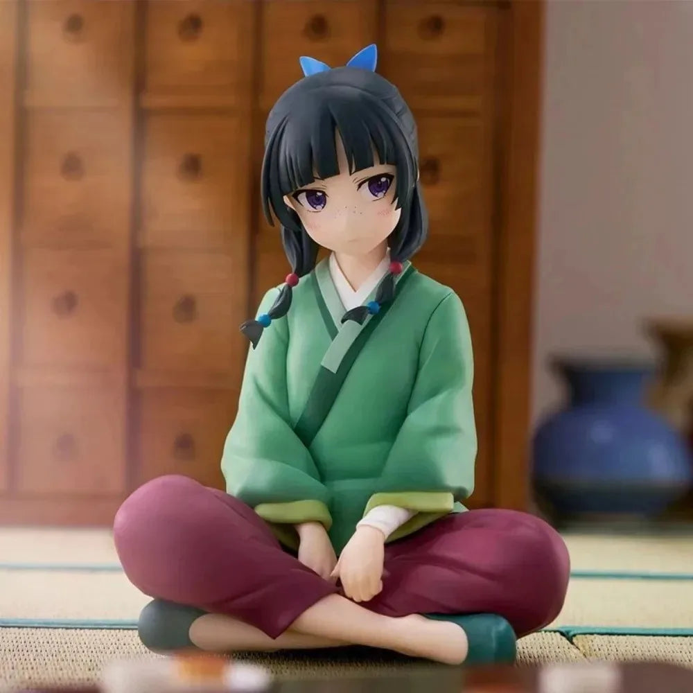A collectible PVC figure of Maomao from The Apothecary Diaries, featuring dark hair and green clothing.