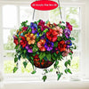 A colorful acrylic floral pendant featuring various flowers and leaves, hanging by a chain.