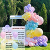 A kit of colorful balloons in pink, purple, yellow, and blue arranged for a balloon garland display.