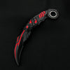 A black anime-style rotating claw knife with red accents is displayed against a dark background.