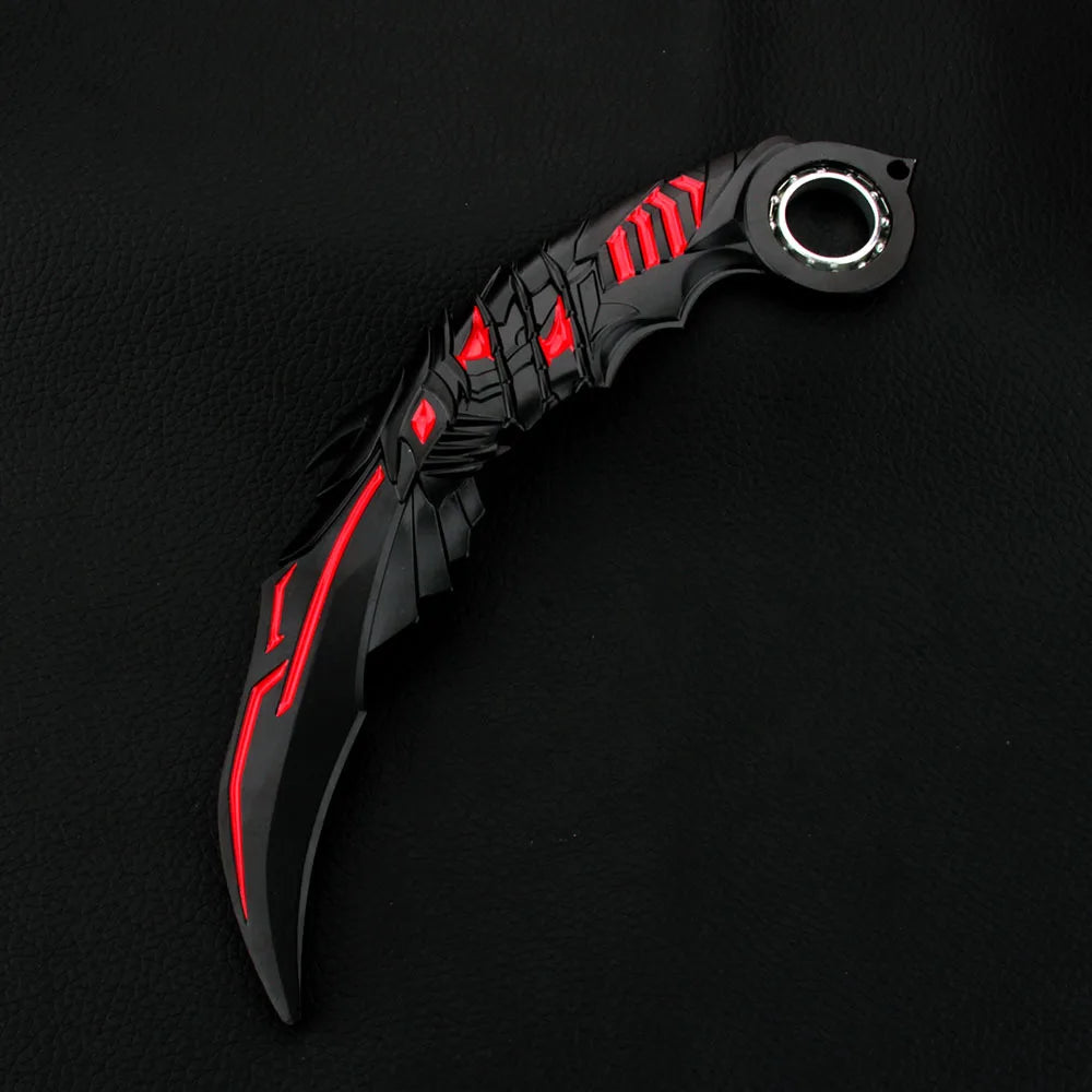 A black anime-style rotating claw knife with red accents is displayed against a dark background.