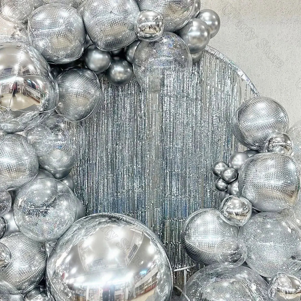 Silver metallic foil fringe curtains used as a party backdrop decor
