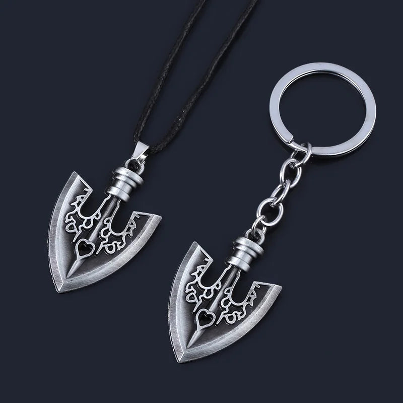 Silver arrow metal keychain featuring an anchor design on a black cord.