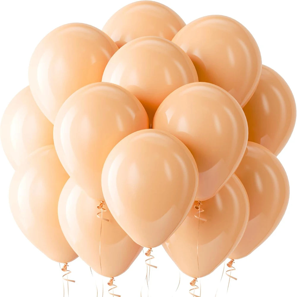 A cluster of light peach latex balloons tied together for celebrations.