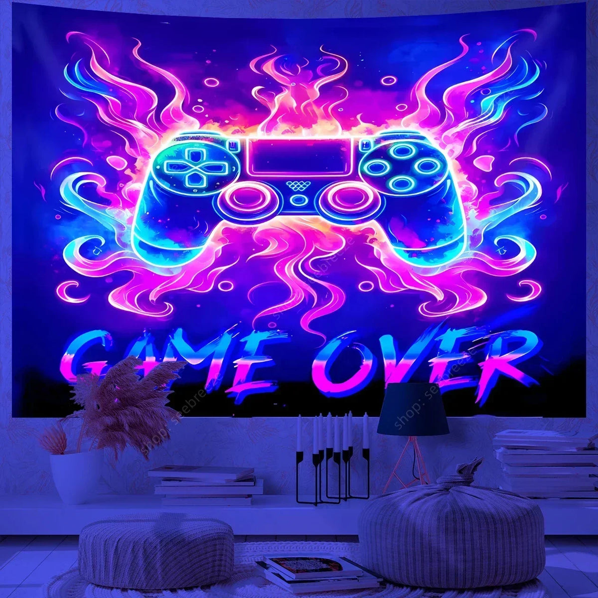 A vibrant purple and pink UV reactive game controller tapestry displayed in a dark room.