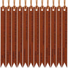 A set of brown leather bible bookmarks with pointed ends hanging from a string.