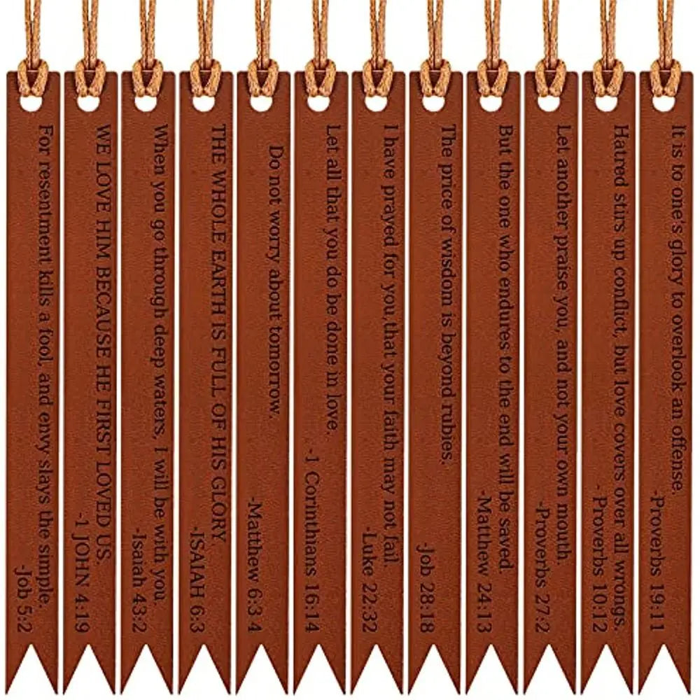 A set of brown leather bible bookmarks with pointed ends hanging from a string.