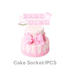 Pink layered cake with a pink bow and baby girl lettering on top