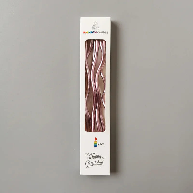 A vertical card displaying a pink curved metallic candle inside, labeled Rainbow Candle and Happy Birthday.