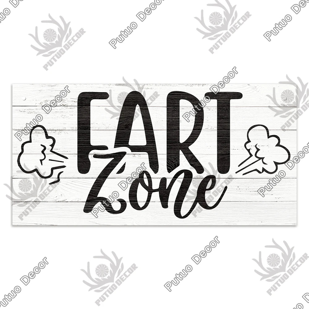 Rustic wooden sign with black script lettering that reads FART ZONE