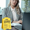A yellow desk sign listing answer desk rates for $1.00, $2.00, and free answers, placed on a desk.