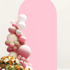 A pink and white balloon floral arrangement against a large pink arch backdrop.