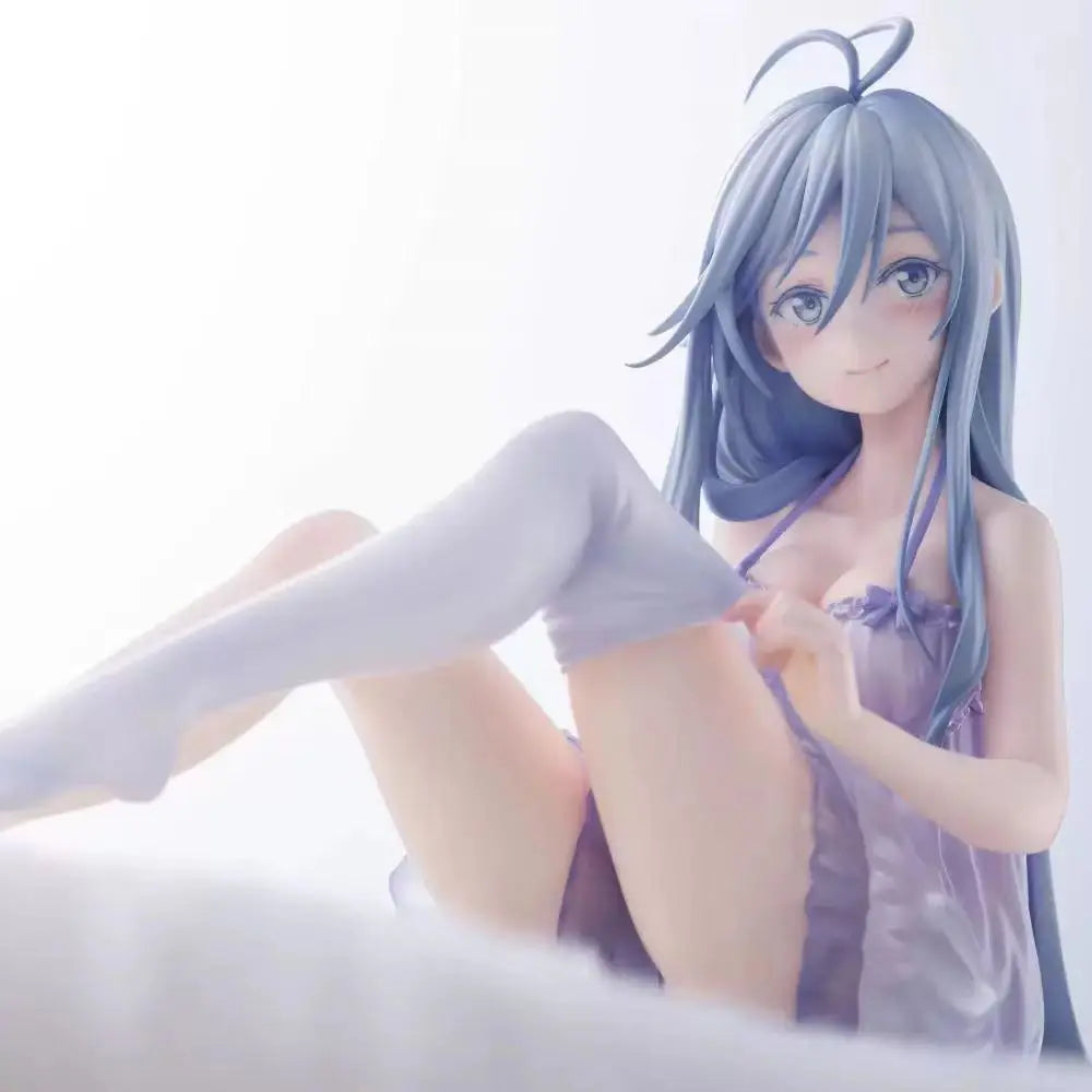 A figurine of an anime girl with light blue hair and clothing sitting in a relaxed pose.