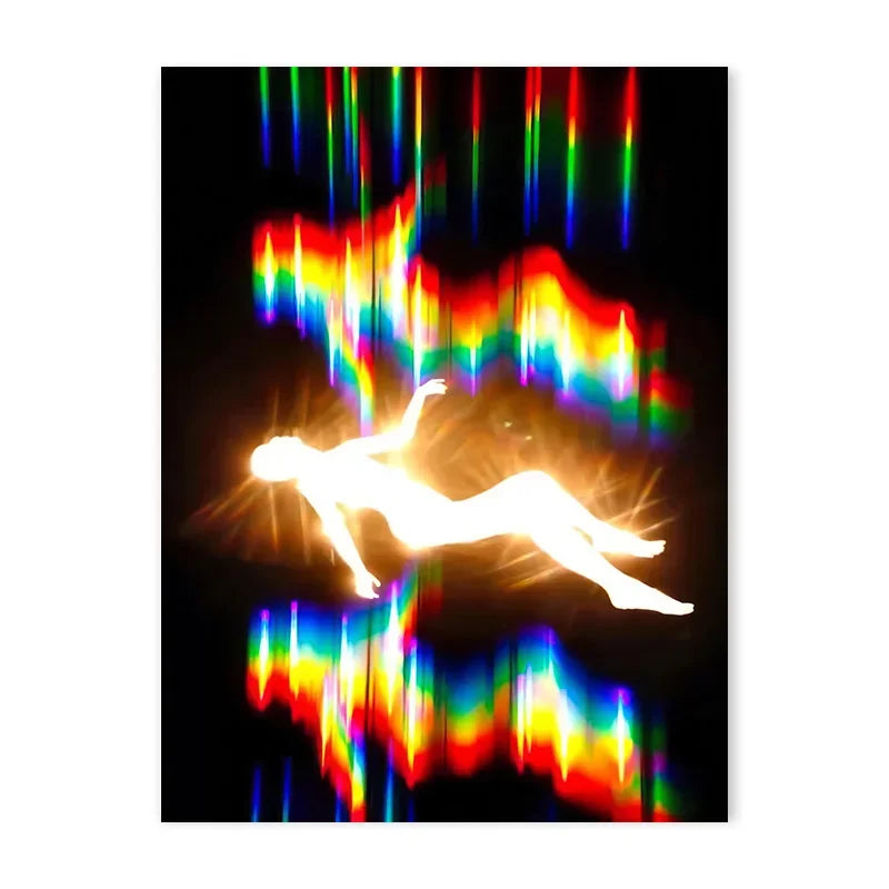 Abstract light painting of a figure silhouetted against vibrant rainbow colors on a black background.