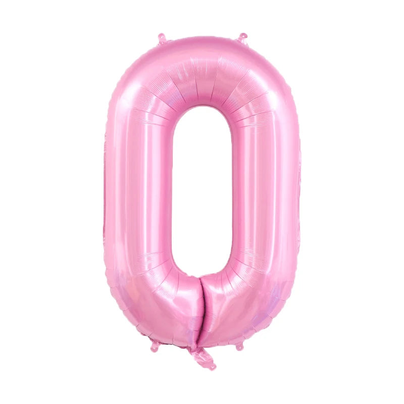 A large, pink foil number balloon shaped like the digit zero.