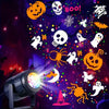 An outdoor LED projector light casts Halloween and Christmas patterns onto a dark background.