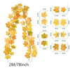 A long, drooping artificial vine featuring yellow and orange maple leaves.
