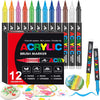 A set of 12 acrylic brush markers in various colors and tips displayed in a box with paint palettes.