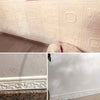 Close-up of white 3D self-adhesive wall trim border featuring floral and geometric patterns on a wall surface.