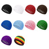 A collection of nine handmade crochet beanie hats in various colors including black white red brown blue pink green and purpl