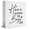 A white rectangular sign with black script that reads Home is where my Boys are and a red heart.