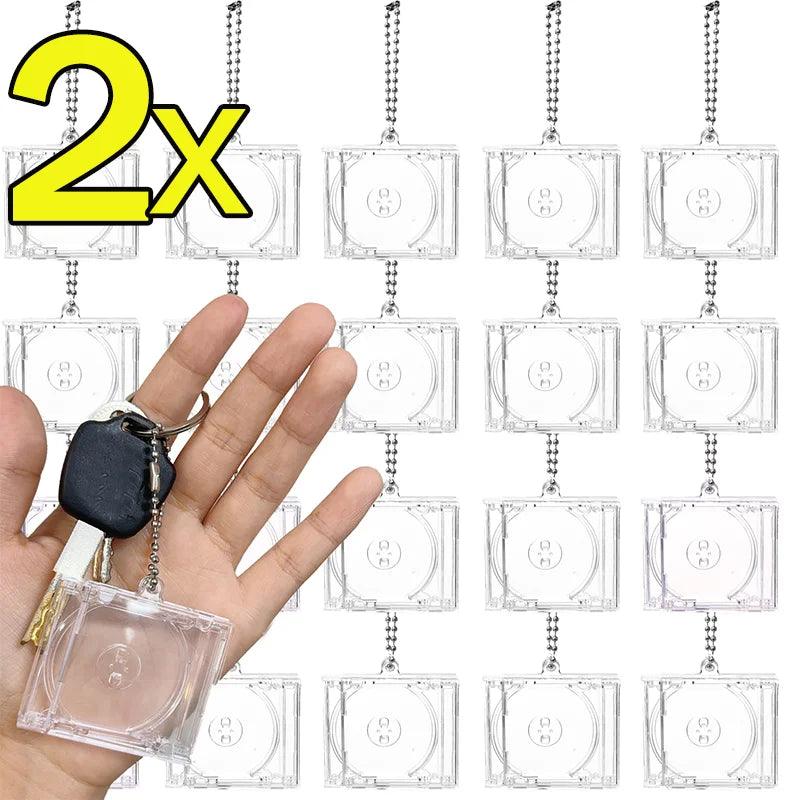 A hand holds a mini transparent CD keychain, demonstrating the product size and use.