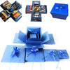 A collection of elegant blue party gift packaging boxes and decorative ribbon bows.